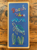 Hand sewn Beach Vibes bookmark with a wave, turtle, and seaweed